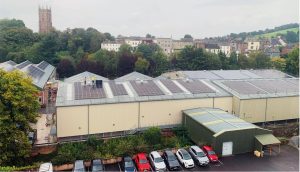 Installing our latest array of solar PV panels on our production building roofs